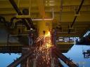 oil gas jobs welder removing topside tie down